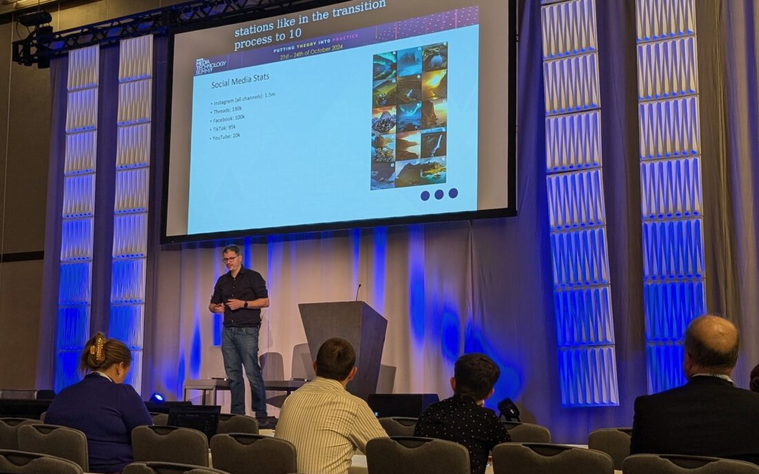 On stage at the SMPTE summit, slide on the screen