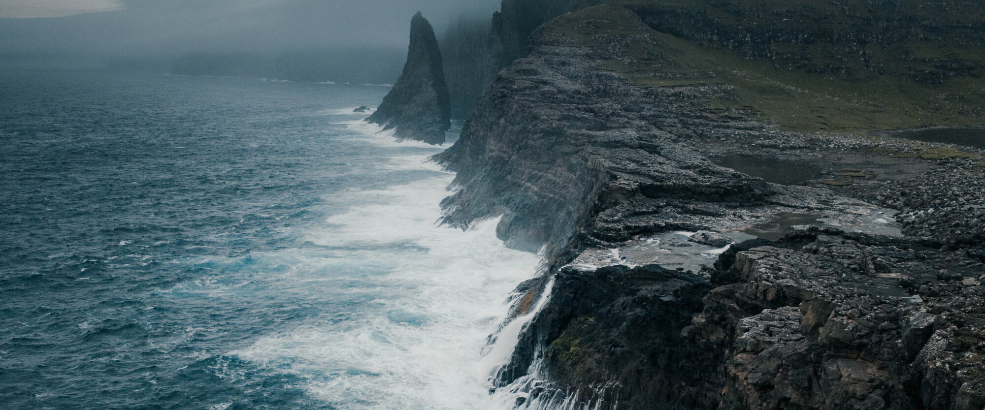 Sea cliff in the rain